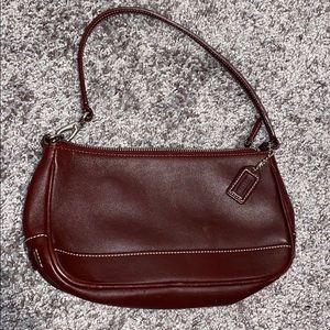 Small maroon coach purse